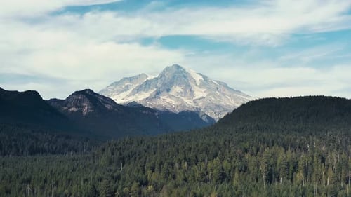 Incredibly gorgeous left to right drone aerial shot of Mt Rainier in Washington State.