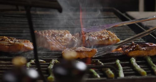 Fish On Grill In Smoke With Vegetables