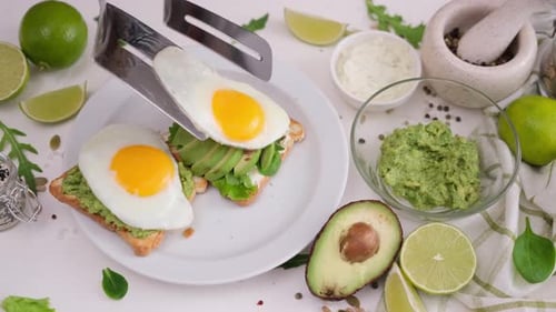 Preparing Avocado Toast with Fried Eggs