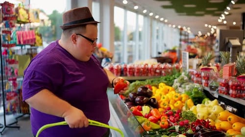 Young Adult Shopping for Fresh Vegetables Indoors