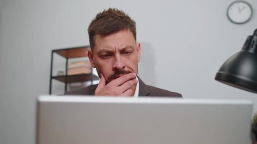 Closeup Businessman Freelancer at Office Workplace Working on Laptop Computer Sends Online Messages
