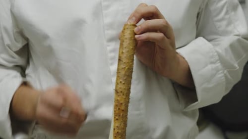 Peeling radish vertically with razor sharp thin knife