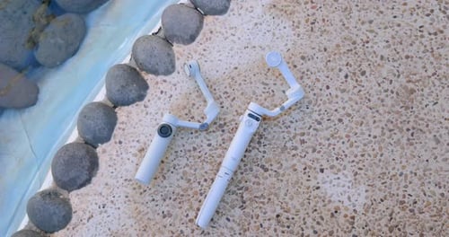 White Camera Gimbals by Shallow Blue Pool