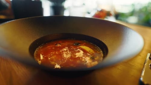 Exquisite Tomato Soup in a Modern Black Bowl