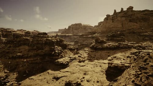 Extensive Canyon Landscape Featuring Textured Sandstone Foreground and Large Sky