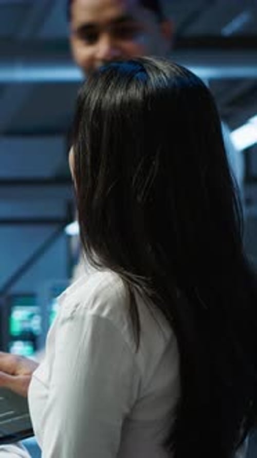 Woman Typing on Tablet in Modern Tech Office