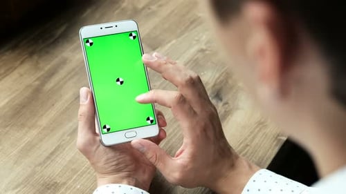 One Businessman Use The Handheld Cellphone With Greenscreen Touchpad And Gesturing Close Up In Wo...