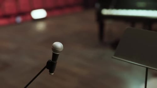 Professional Microphone and Piano on Stage for Live Performance