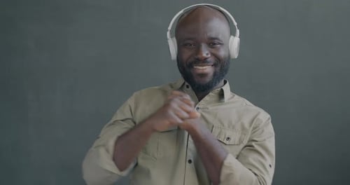 Man Dancing with Headphones On Indoors