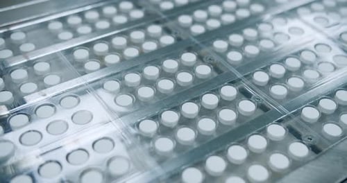 Video of White Pill Manufacturing Process with Closeups in Factory and Pharmacy