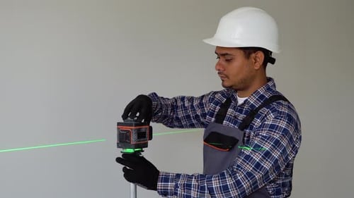 Indian Man Adjusting Laser Level Tool Laser Leveler Device