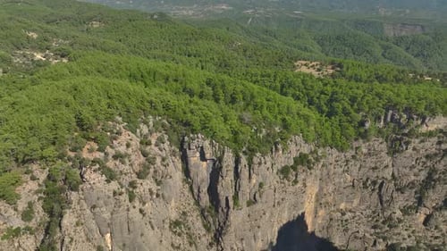 Aerial View Friends Posing on the Cliff of a Beautiful Canyon in Turkey