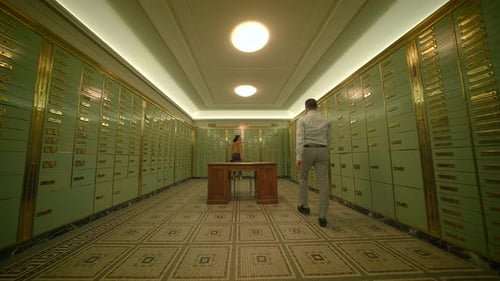 Sales Team Having a Serious Matter of Conversation Inside the Vault Room