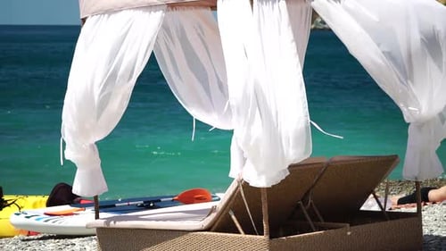 Bungalows Sea Beach Lounge Bed with White Silky Curtains Lounge Bed with Canopy at Seaside Beach