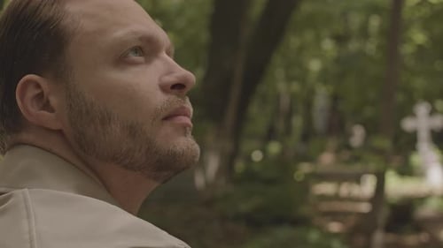 Grieving Man at Cemetery