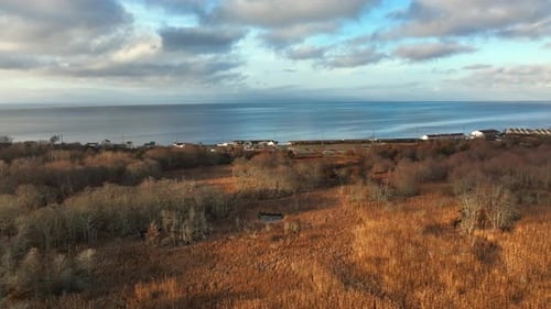 An aerial view over a salt marsh in Greenport, NY by the Long Island Sound on a beautiful day with b