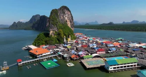 Village Built On Stilts At Koh Panyee In Phang Nga Bay In Thailand. - aerial shot