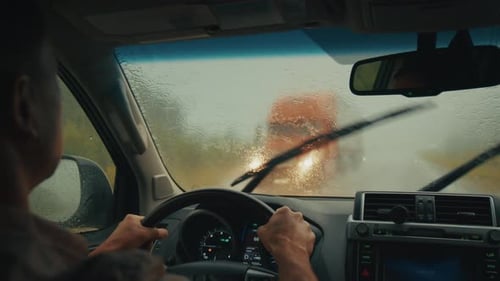 Limited Visibility Driving Man Steers the Car on a Narrow Rural Road During Heavy Rain Shower with