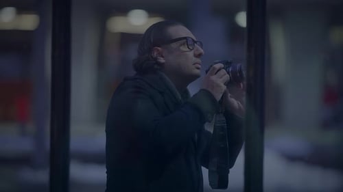 Man Taking Pictures with Camera at Night