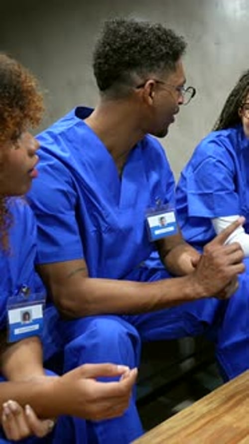 Medical Professionals Review X-ray on Tablet in Office