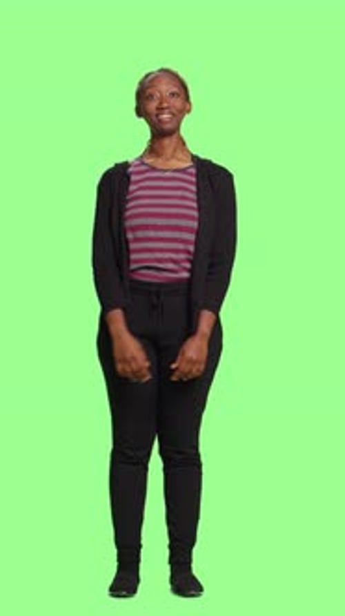 Vertical Video Modern Woman Looking at 3d Hologram Over Greenscreen Backdrop
