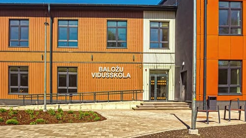Students walks in the hallway of the Balozi school in Riga. Motion blur timelapse