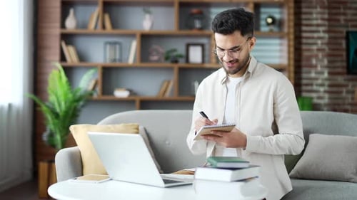 Young Man Working From Home, Writing Notes