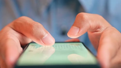 A person is typing a message to AI on their smartphone.