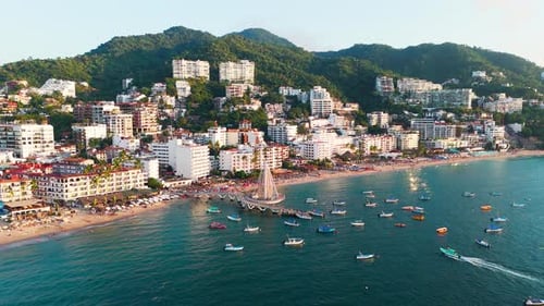 Hotel zone in Los Muertos beach and emblematic pier in Puerto Vallarta, Mexico