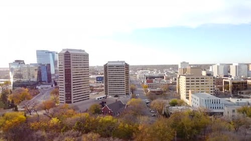 Cinematic Drone Over Saskatoon Downtown Along River Bank