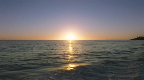 Cinematic Panorama of Endless Ocean Waters and Bright Sunbeams on Waves