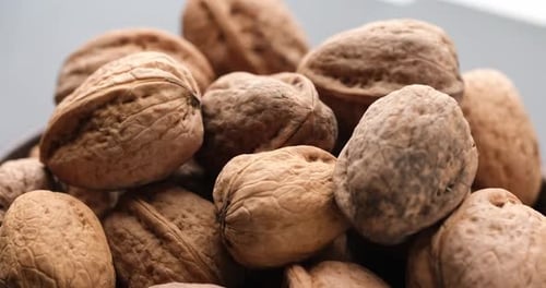 Pile of Crunchy Whole Walnuts in Shells