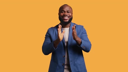 Man Happily Clapping Hands Applauding Studio Background