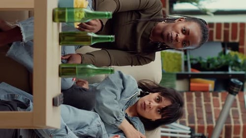 Stressed Women Sit on Couch in Apartment