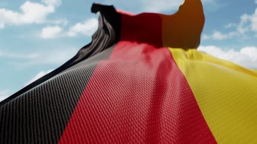 Realistic Waving German Flag with Textured Fabric against Blue Sky