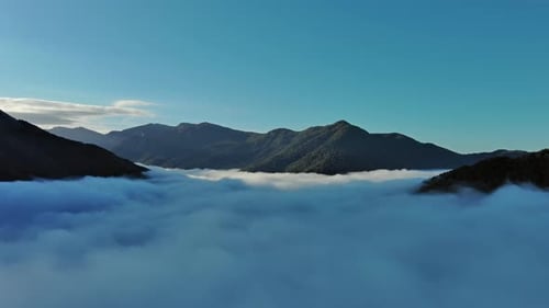 Aerial View of Clouds and Mountains at Sunrise