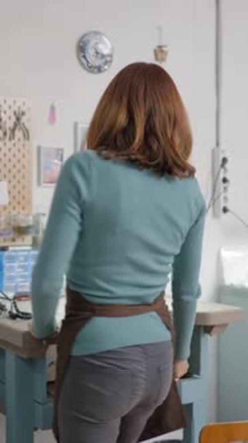 Craftswoman Working at Workbench in Her Workshop