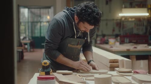 Man Sands Wood in Workshop