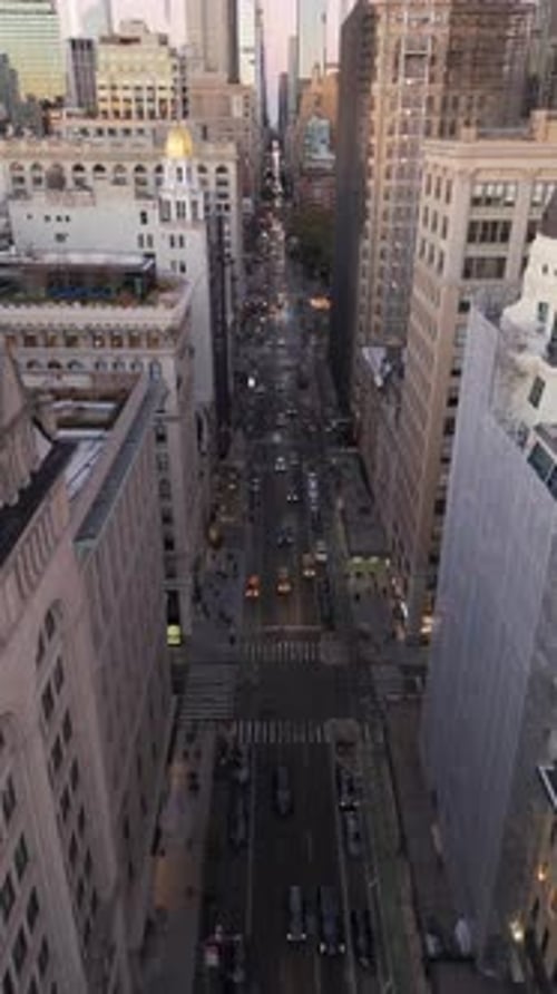 Vertical Screen Panning Up Reveals Fifth Avenue in Midtown Manhattan New York City Cars Traverse