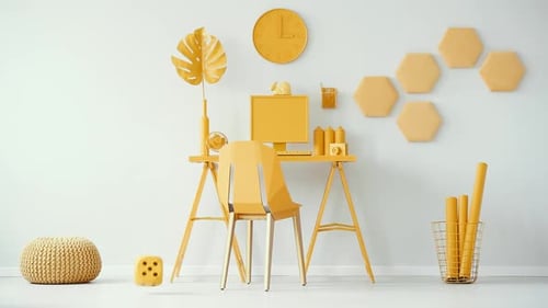Bright yellow home office cinemagraph with plush dice rolls on desk