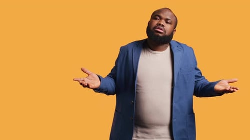 Man Shrugging Shoulders Not Caring Studio Background