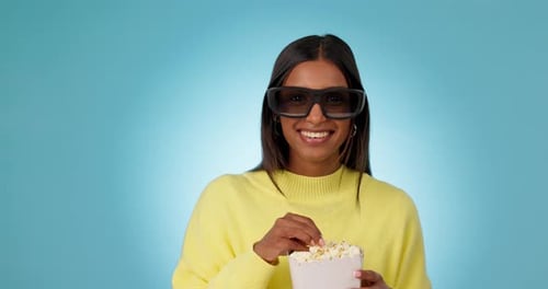 Smiling Woman Wearing 3D Glasses Eating Popcorn