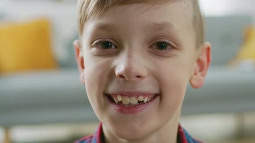 Smiling Boy Poses for a Close-Up Shot