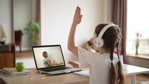 Girl Learning Online at Home with Laptop