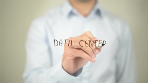 Data Center Man Writing on Transparent Screen