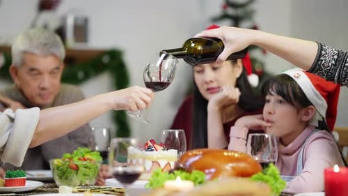 Family Celebrates Christmas Dinner at Home