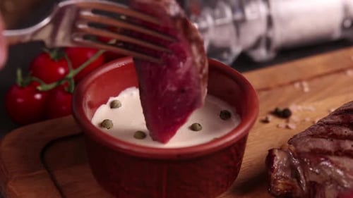 a restaurant guest cuts a steak