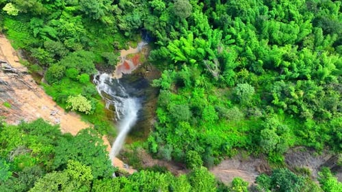 Aerial View of a Tropical Waterfall and Forest
