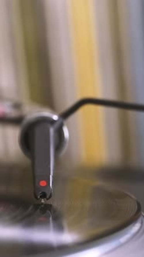 DJ Headshell on Spinning Turntable Listening the Music on Vinyl Vertical Footage