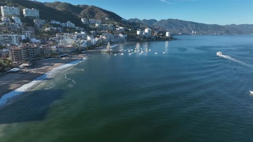 Playa De Los Muertos beach and pier close to famous Puerto Vallarta Malecon, the city largest public